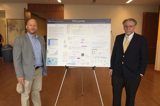 Brian Funaro and Peter Charpentier present a REDCap poster at Yale's Day of Data