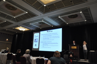 Peter Charpentier and Mary Geda present an EM at a REDCap Plenary Session