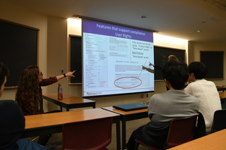 Janet Miceli and Mary Geda point out features that support compliance during training session